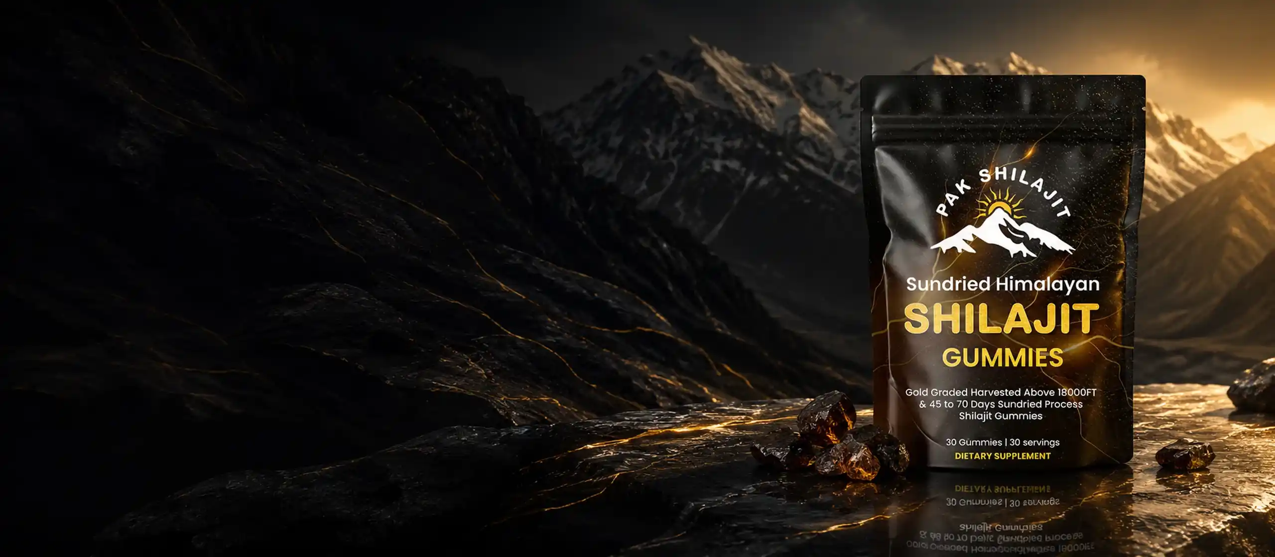 PakShilajit Sundried Himalayan Shilajit Gummies pouch against a dark Himalayan stone backdrop.